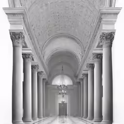 a room with a ceiling that has some large columns