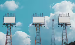 three cell phones with one of them displaying their messages