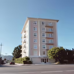 the apartment building has balconies and windows