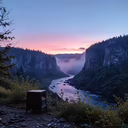 a view of a river, cliffs, and valley from a trail