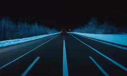 a car driving on the road in the winter