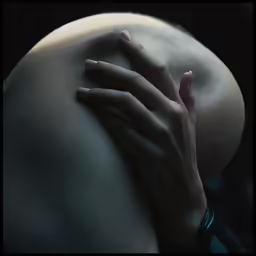 the hand on the shoulder of the human being touched by another hand