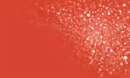 a bright red background with small white dots