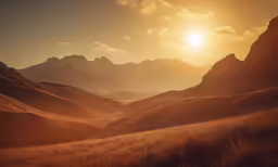 the sun rises over some mountain tops