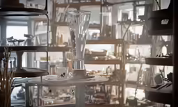 several items and lighting fixtures in a room with shelves