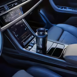 the center console of a car with a remote