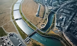 an aerial view of an area next to some water