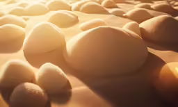 several large rocks sitting on top of sand