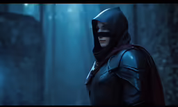 a male character dressed as the avengers with a hood and cape