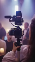a woman is recording a video with her cell phone