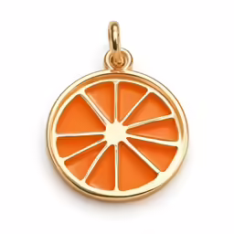a gold charm with an orange slice on it