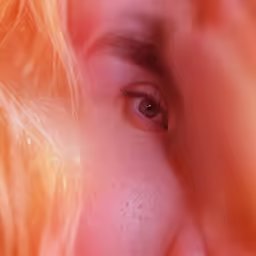 an eye in front of a sunbeam with its reflection