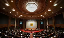 the inside of a large conference room at an auditorium