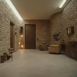 a large room with stone walls and benches in it