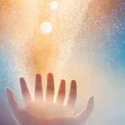 a hand reaching out to a blue sky