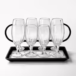a metal tray with five glasses on it