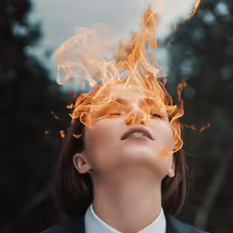 a woman with fire breathing to breathe