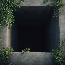 a square stone box with green vines on the outside of it