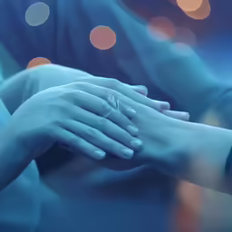 two people with their hands on each other