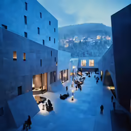a group of people walking in front of some buildings