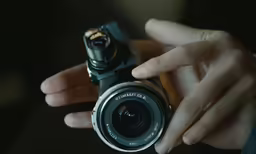 a man taking a picture of himself with his small camera