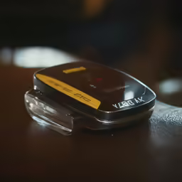 a cellular phone laying open on a table