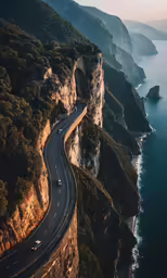 the car is driving along an ocean cliff road