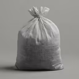 a silver bag full of trash with a small bow