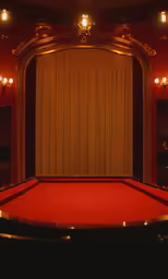 a room with lots of lights and a red table