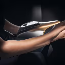 a person holding the steering wheel while in a car