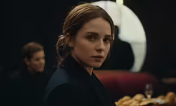 a woman looking out on the other side of the camera