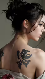 the woman with many tattoo on her shoulder