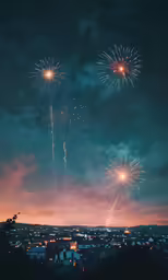 a night shot of a city and fireworks