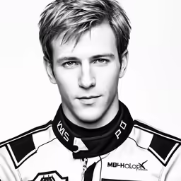 a man wearing a racing suit with a smile