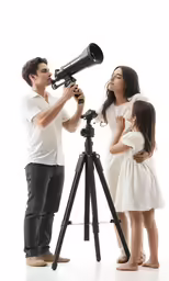 an adult and a little girl using a telescope