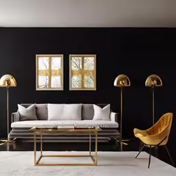 two yellow chairs are sitting beside a white couch