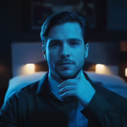 a man is getting ready to tie his tie