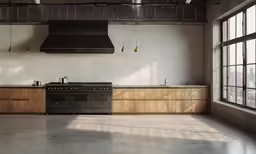 an industrial kitchen with a stove and a sink