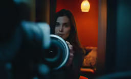 a woman is taking a photo of her own self with a camera