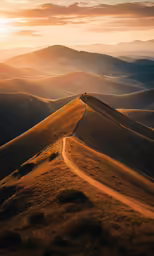 the road uphill on the side of a grassy hill
