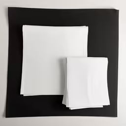 two napkins that are sitting on top of each other