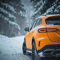 a close up of the rear end of a car in the snow