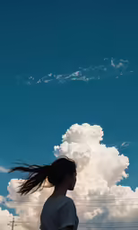 a woman with long hair flying in the sky