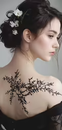 this woman has black flowers on her back