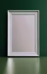a plain white mirror is framed against a green wall