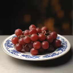 grapes are sitting on a plate ready for consumption