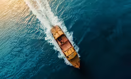 a boat is in the ocean riding on waves
