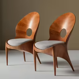 two chairs are sitting next to each other on the floor