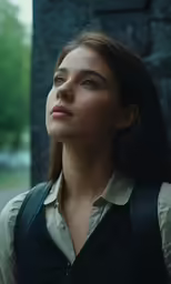 a woman in an up - close image, looking sideways