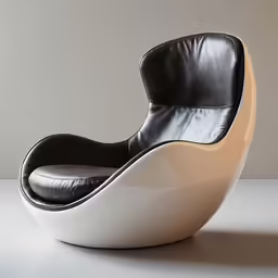 a white chair that is sitting on top of a table